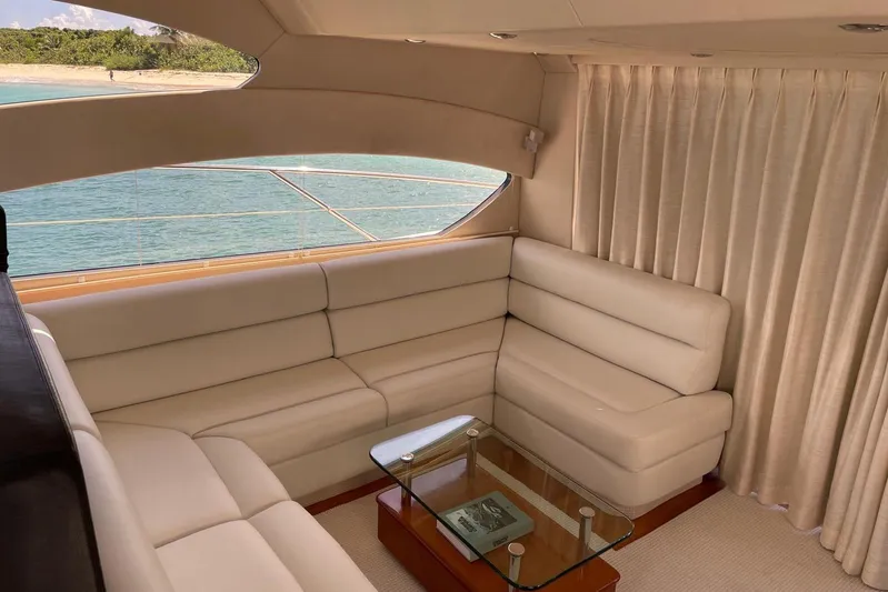 Relentless Yacht Photos Pics Luxurious interior of 2009 Sunseeker Predator 62 yacht with cream leather seating.