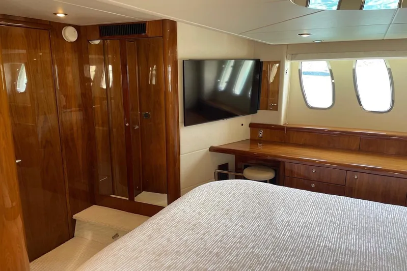 Relentless Yacht Photos Pics Luxurious interior of 2009 Sunseeker Predator 62 yacht with wood finishes and modern amenities.