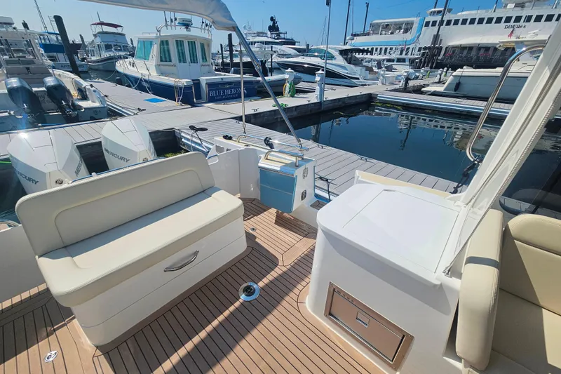 Sandora Yacht Photos Pics Luxury MJM 35 yacht interior with seating, docked at marina, 2023 model.