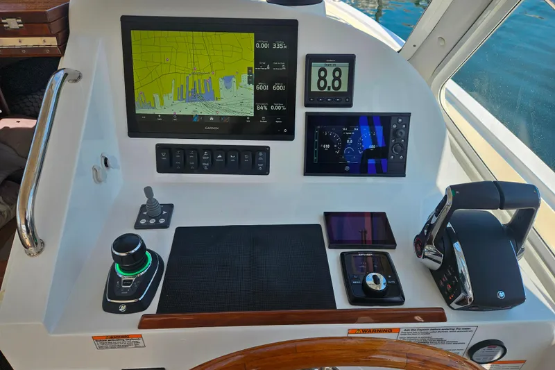 Sandora Yacht Photos Pics Control panel of 2023 MJM 35 boat with navigation and throttle systems.