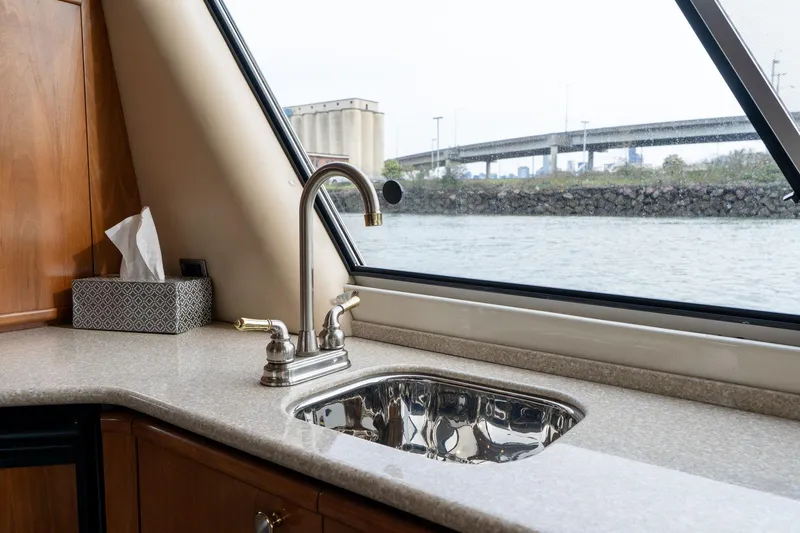 Candykiss Yacht Photos Pics Luxury yacht kitchen sink with a view, Meridian 490 Pilothouse, 2003 model.