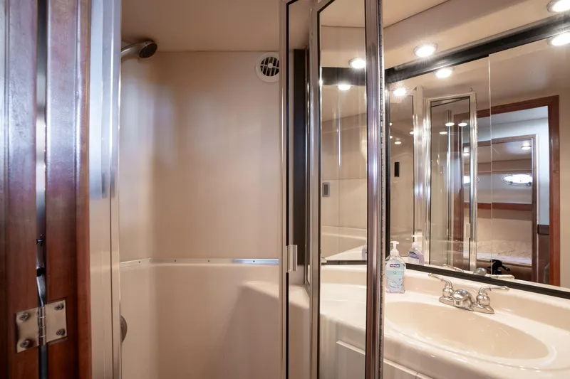 Candykiss Yacht Photos Pics Bathroom interior of 2003 Meridian 490 Pilothouse yacht with shower and sink.