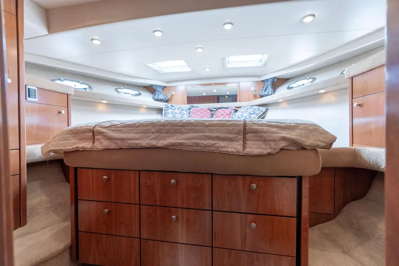 Candykiss Yacht Photos Pics Luxurious bedroom interior of 2003 Meridian 490 Pilothouse yacht with wood cabinetry.