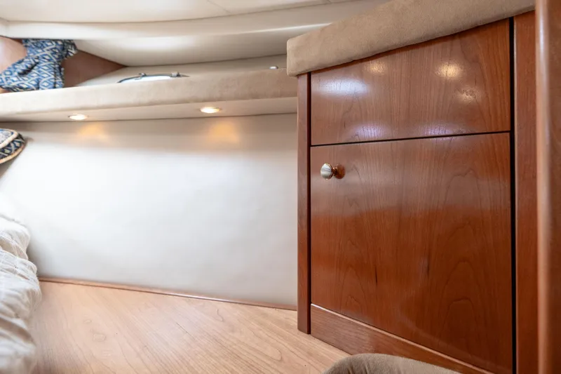 Candykiss Yacht Photos Pics 2003 Meridian 490 Pilothouse interior with wooden cabinet and cozy lighting.