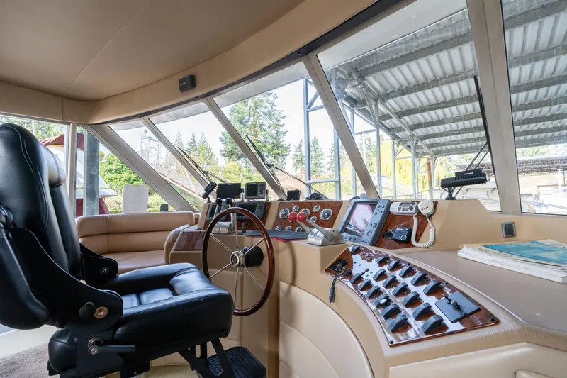 Candykiss Yacht Photos Pics 2003 Meridian 490 Pilothouse interior with steering wheel and control panel.