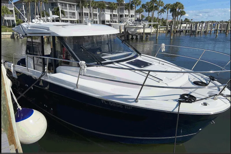 Iffin Yacht Photos Pics 2018 Jeanneau NC 895 boat docked at marina with waterfront view.