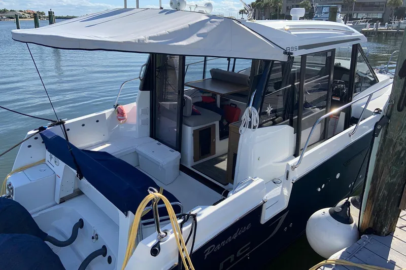 Iffin Yacht Photos Pics 2018 Jeanneau NC 895 boat docked, featuring spacious deck and modern design.