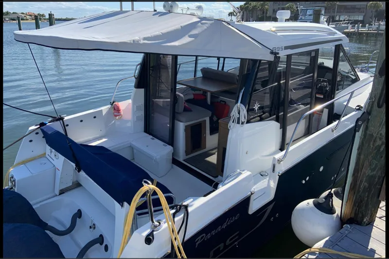 Iffin Yacht Photos Pics 2018 Jeanneau NC 895 boat docked, featuring spacious deck and modern design.