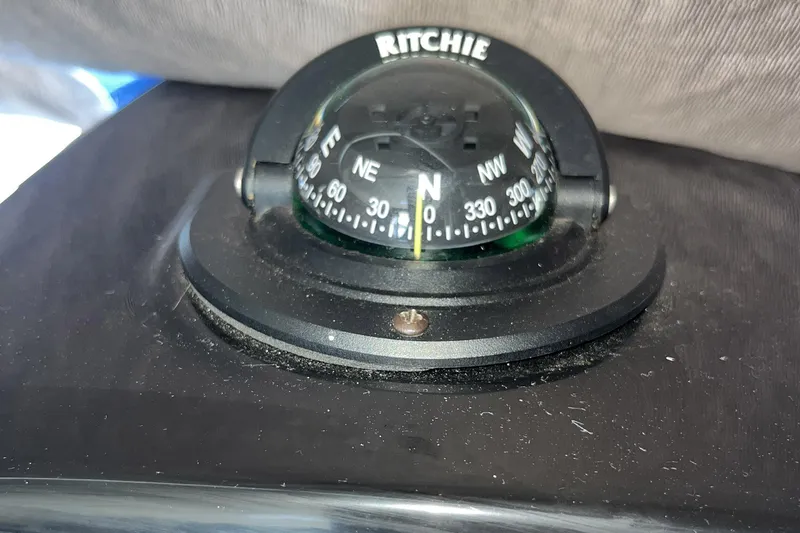 Iffin Yacht Photos Pics Ritchie compass on 2018 Jeanneau NC 895 boat dashboard.