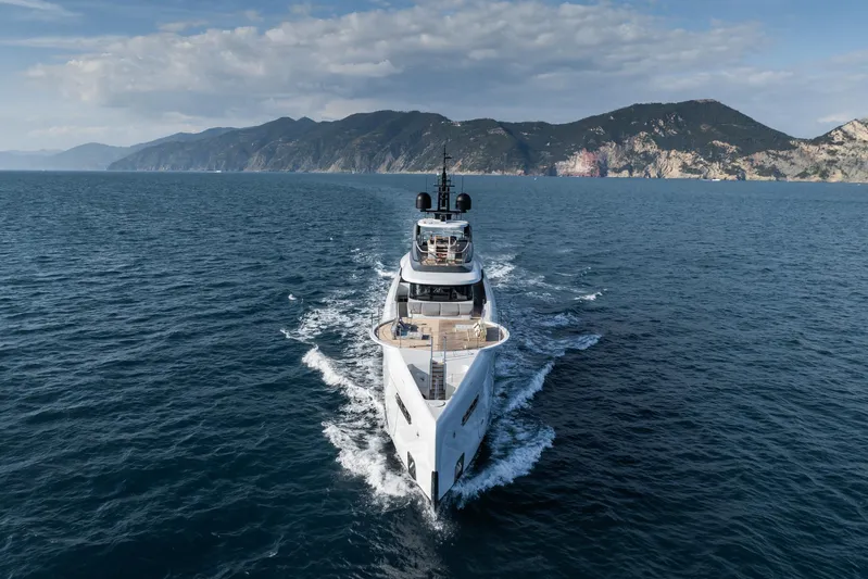 Silver Star I Yacht Photos Pics Luxury yacht Admiral 55 S-Force 2023 cruising on open sea with scenic mountain backdrop.