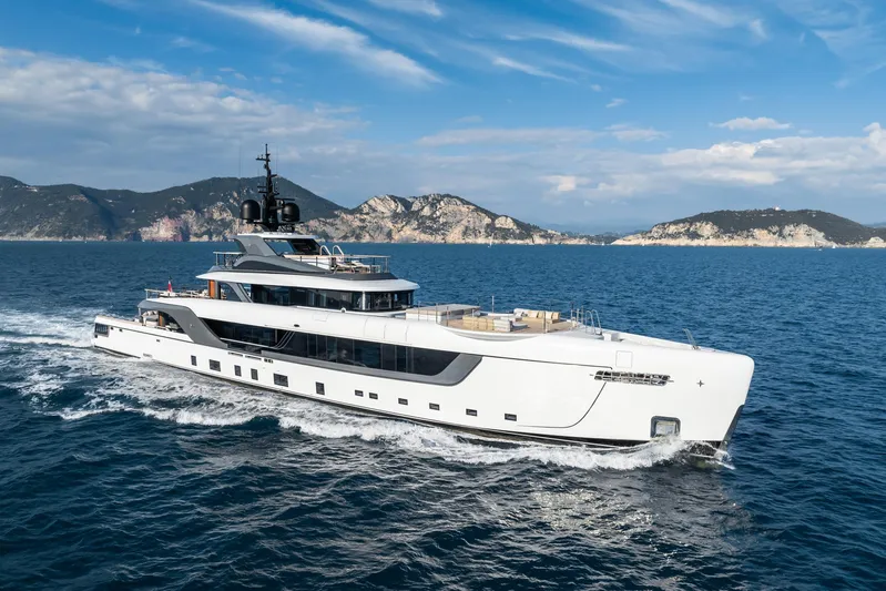 Silver Star I Yacht Photos Pics Luxury yacht Admiral 55 S-Force 2023 cruising on open sea with scenic mountain backdrop.
