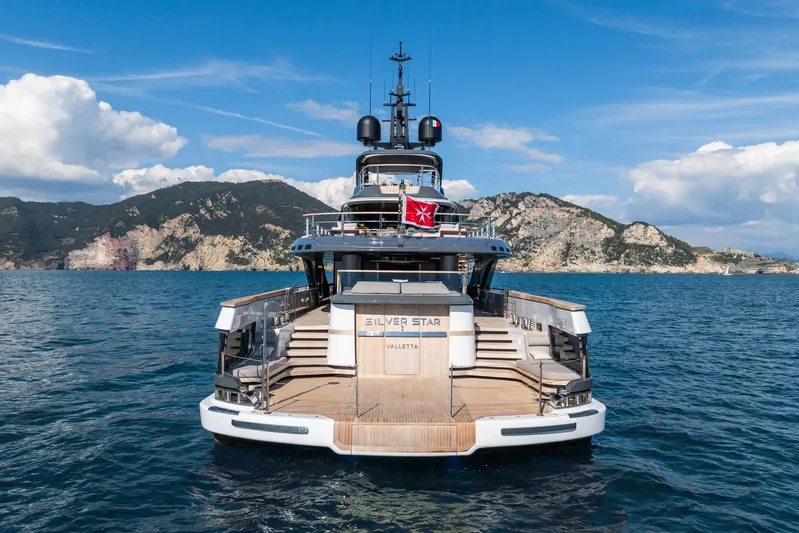 Silver Star I Yacht Photos Pics 2023 Admiral 55 S-Force yacht on open sea with scenic mountain backdrop.