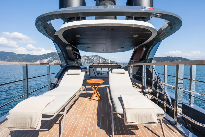 Silver Star I Yacht Photos Pics Luxurious 2023 Admiral 55 S-Force yacht deck with sun loungers and scenic ocean view.