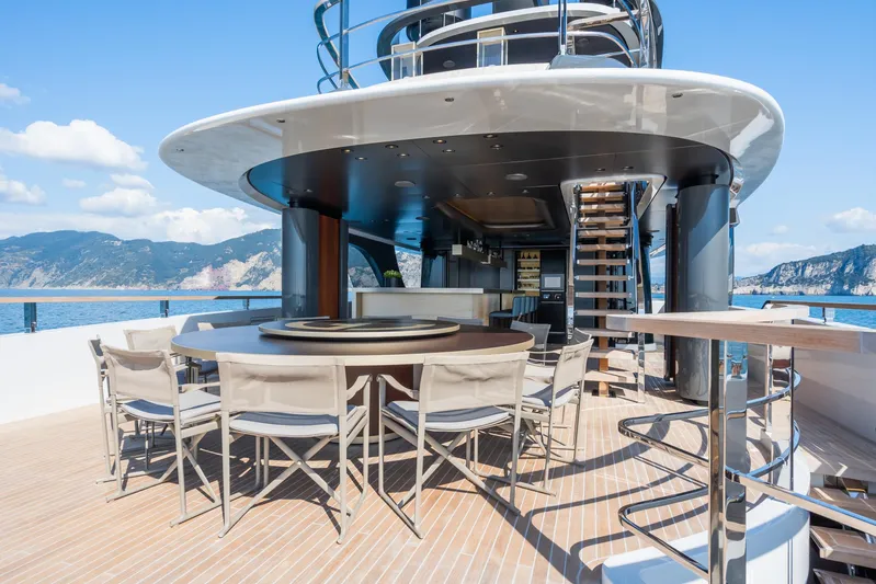 Silver Star I Yacht Photos Pics Luxurious Admiral 55 S-Force yacht deck with dining area, modern design, and scenic ocean view.