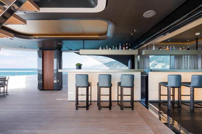 Silver Star I Yacht Photos Pics Luxurious interior of 2023 Admiral 55 S-Force yacht with modern bar and ocean view.