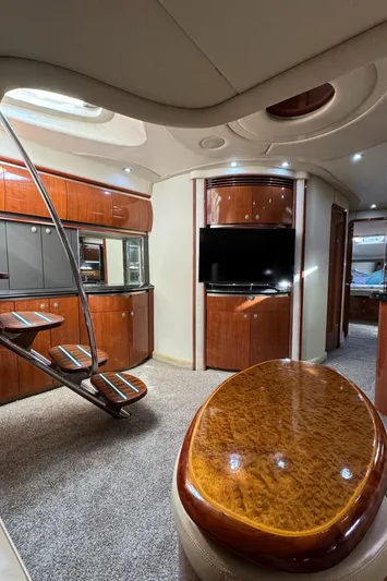  Yacht Photos Pics Luxurious interior of a 2004 Sea Ray 500 Sundancer yacht with wooden finishes.