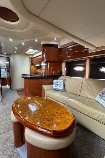  Yacht Photos Pics Luxurious interior of a 2004 Sea Ray 500 Sundancer yacht with elegant wood finishes.