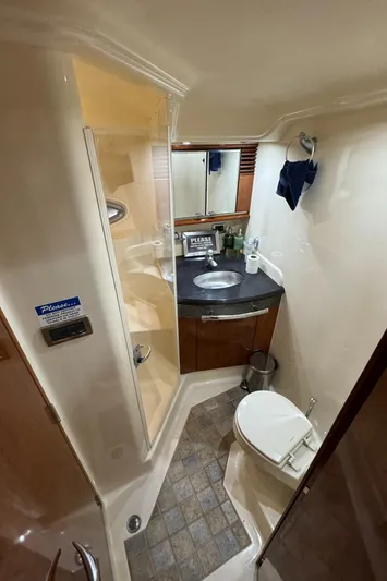  Yacht Photos Pics 2004 Sea Ray 500 Sundancer bathroom with shower, sink, and toilet.