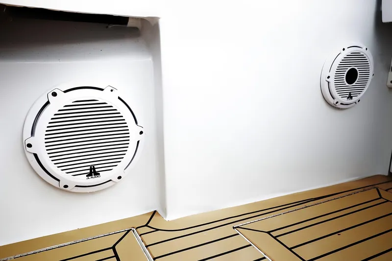 Fifth Day Yacht Photos Pics Speakers on a 2000 Venturer 44 boat with teak-style flooring.