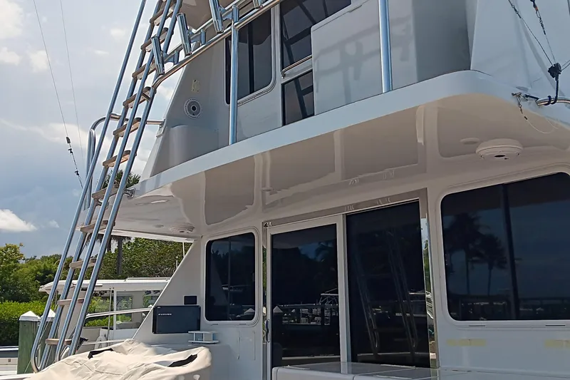 Fifth Day Yacht Photos Pics Voyager 44 yacht, 2000 model, featuring sleek design and outdoor ladder.