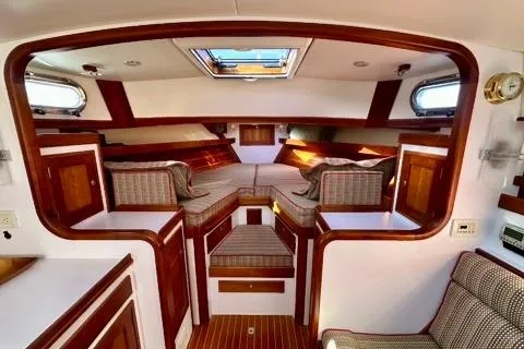 Maestro Yacht Photos Pics 2006 Lyman-Morse 38 Jet Boat interior with elegant wood finish and cozy seating.