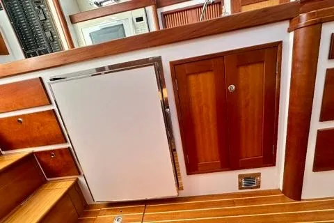 Maestro Yacht Photos Pics Interior of 2006 Lyman-Morse 38 Jet Boat with wooden cabinetry and modern appliances.