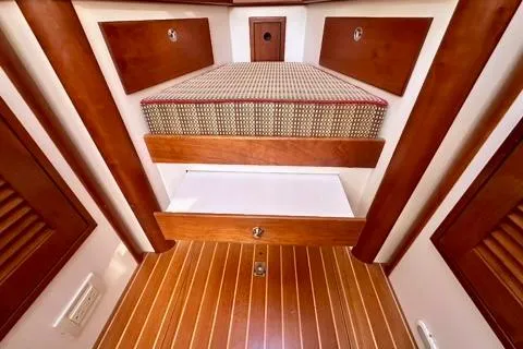 Maestro Yacht Photos Pics Interior of 2006 Lyman-Morse 38 Jet Boat with wood finish and storage.