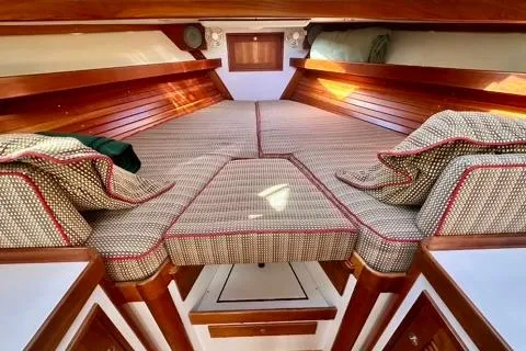 Maestro Yacht Photos Pics Interior of 2006 Lyman-Morse 38 Jet Boat with cushioned seating and wooden accents.