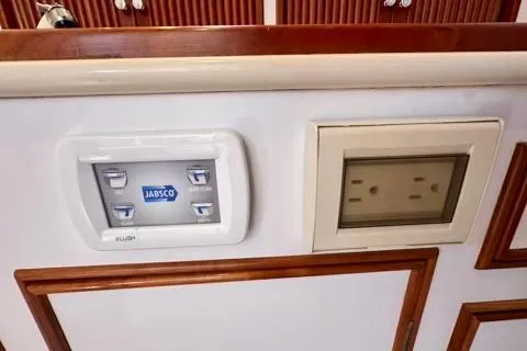 Maestro Yacht Photos Pics Control panel and outlet on 2006 Lyman-Morse 38 Jet Boat interior.