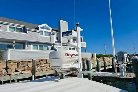 Maestro Yacht Photos Pics 2006 Lyman-Morse 38 Jet Boat docked near waterfront homes, featuring Raymarine equipment.