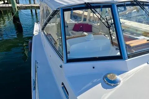 Maestro Yacht Photos Pics 2006 Lyman-Morse 38 Jet Boat docked, showcasing sleek design and spacious interior.