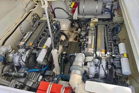 Maestro Yacht Photos Pics Engine compartment of 2006 Lyman-Morse 38 Jet Boat, showcasing dual engines and mechanical components.