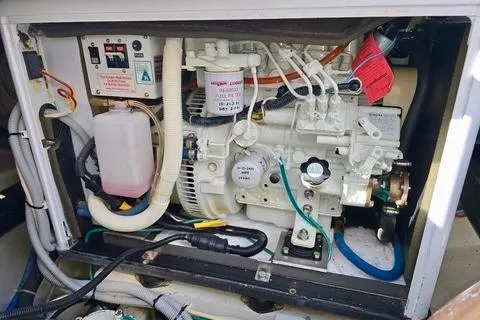 Maestro Yacht Photos Pics Engine compartment of a 2006 Lyman-Morse 38 Jet Boat, showcasing mechanical components.