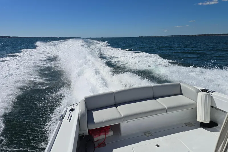 Maestro Yacht Photos Pics Lyman-Morse Monhegan 38 boat cruising on open water, leaving a wake behind.