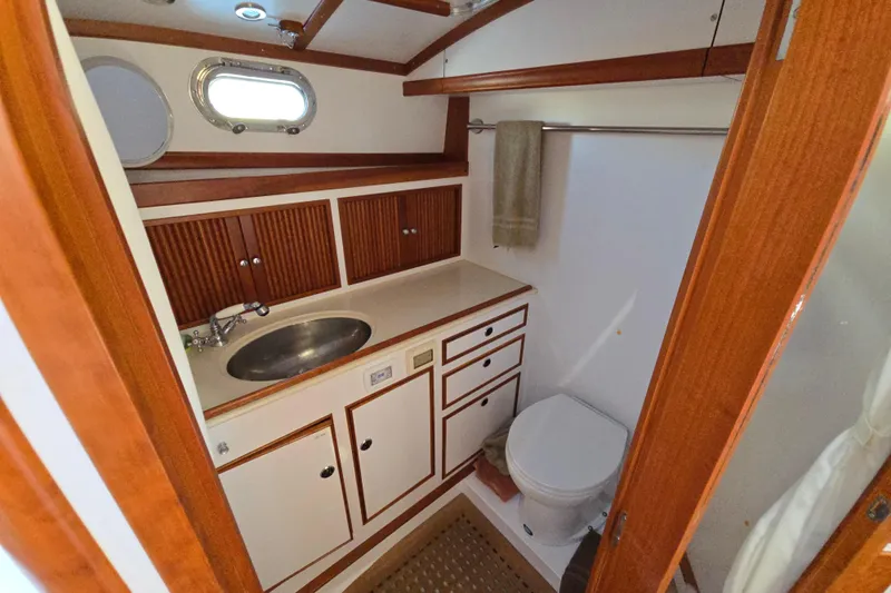 Maestro Yacht Photos Pics Luxurious 2006 Lyman-Morse Monhegan 38 yacht bathroom with wood accents and modern fixtures.