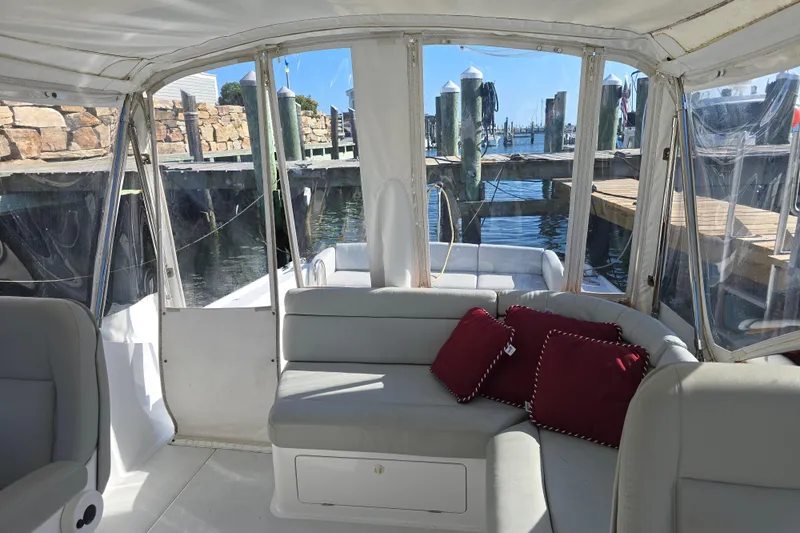 Maestro Yacht Photos Pics Interior view of 2006 Lyman-Morse Monhegan 38 boat with seating and red cushions.