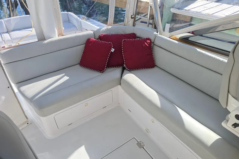 Maestro Yacht Photos Pics Luxurious seating area on 2006 Lyman-Morse Monhegan 38 yacht with red cushions.