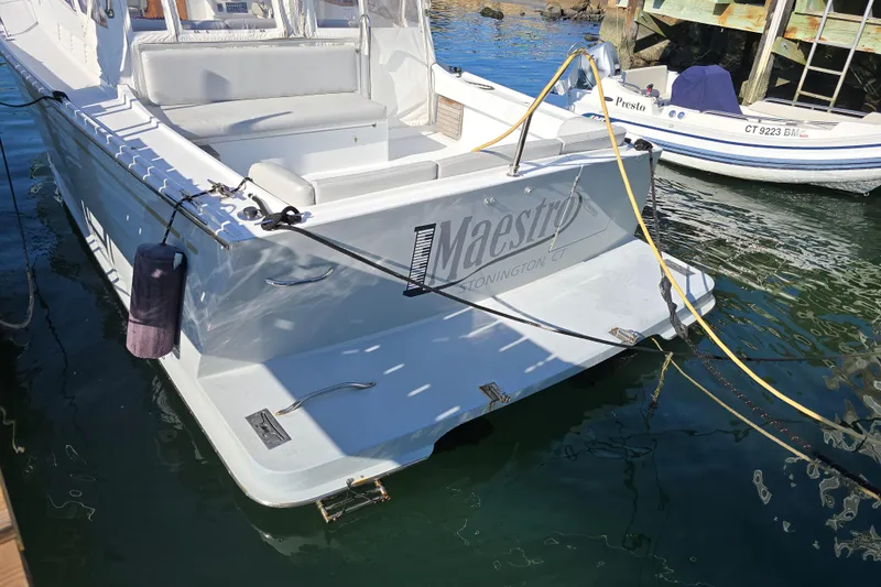 Maestro Yacht Photos Pics Lyman-Morse Monhegan 38 Twin Jet boat docked, rear view, 2006 model.
