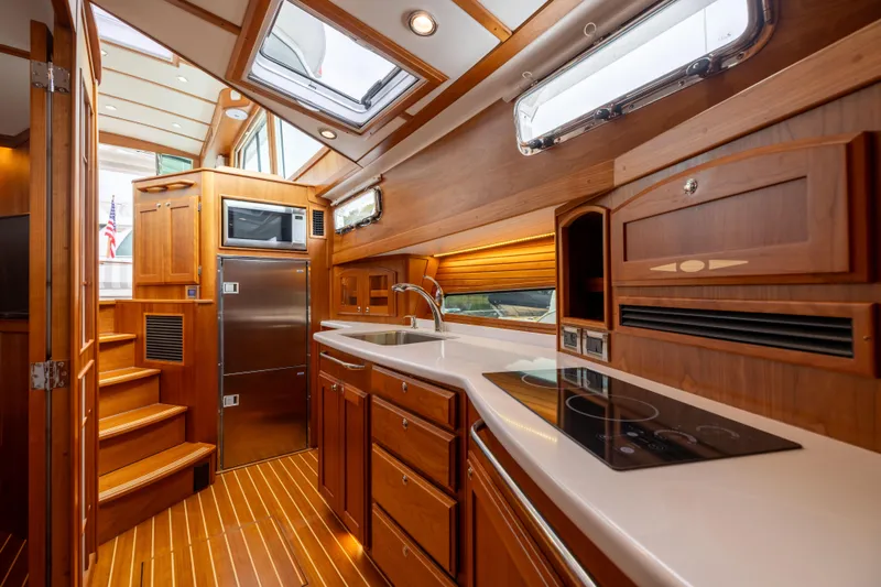  Yacht Photos Pics Luxurious interior of 2022 Sabre 48 Salon Express yacht with modern kitchen amenities.