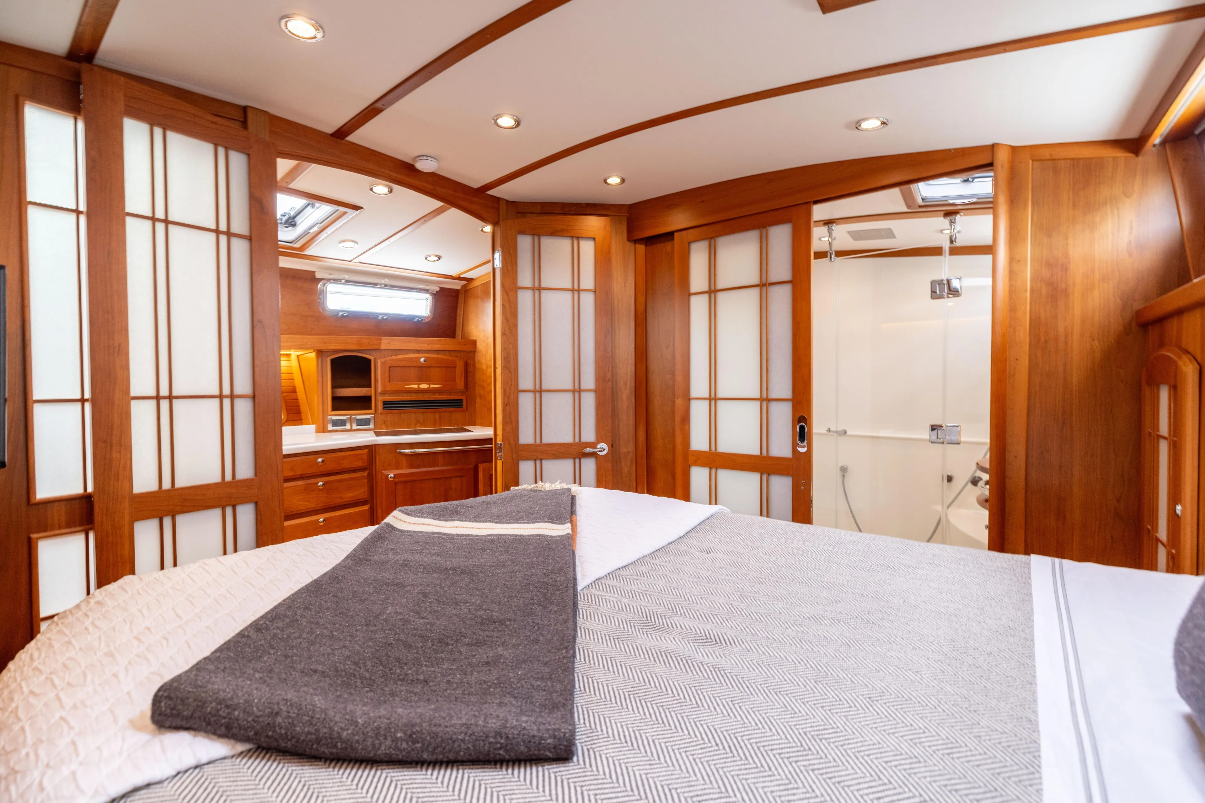  Yacht Photos Pics Luxurious interior of 2022 Sabre 48 Salon Express yacht with wood paneling and modern amenities.