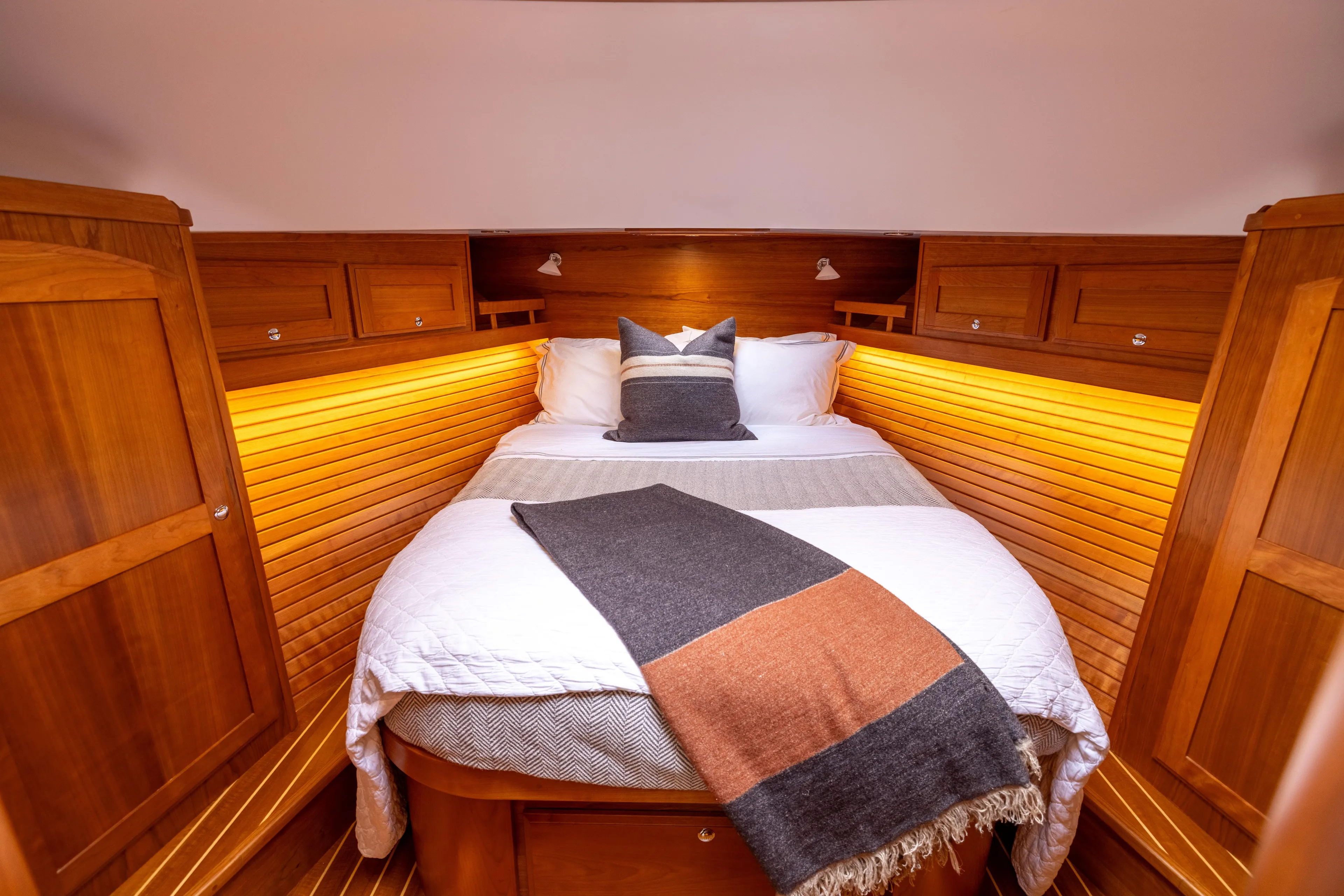  Yacht Photos Pics Luxurious cabin interior of 2022 Sabre 48 Salon Express yacht with cozy bedding.