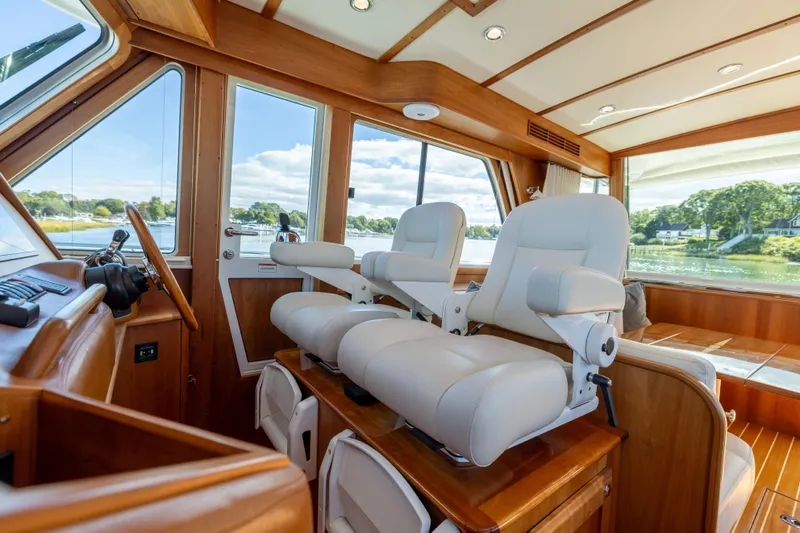  Yacht Photos Pics Interior of 2022 Sabre 48 Salon Express yacht with luxurious seating and scenic views.