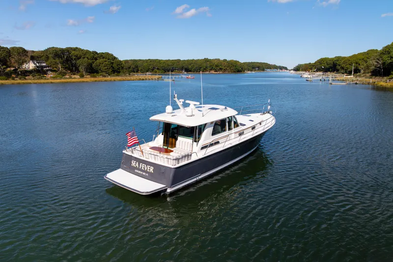  Yacht Photos Pics 2022 Sabre 48 Salon Express yacht cruising on a scenic river.