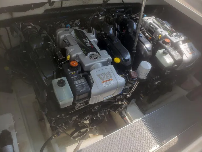  Yacht Photos Pics Engine compartment of a 2014 Formula 350 Sun Sport boat, showcasing dual engines.