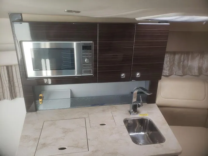  Yacht Photos Pics 2014 Formula 350 Sun Sport yacht interior kitchen with microwave and sink.