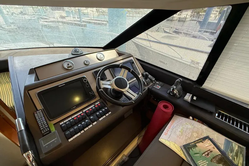 50 Prestige Flybridge Yacht Photos Pics Cockpit of 2013 Prestige 50 Flybridge yacht with navigation equipment and steering wheel.