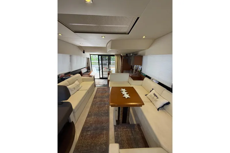 50 Prestige Flybridge Yacht Photos Pics Luxurious interior of a 2013 Prestige 50 Flybridge yacht with elegant seating and decor.