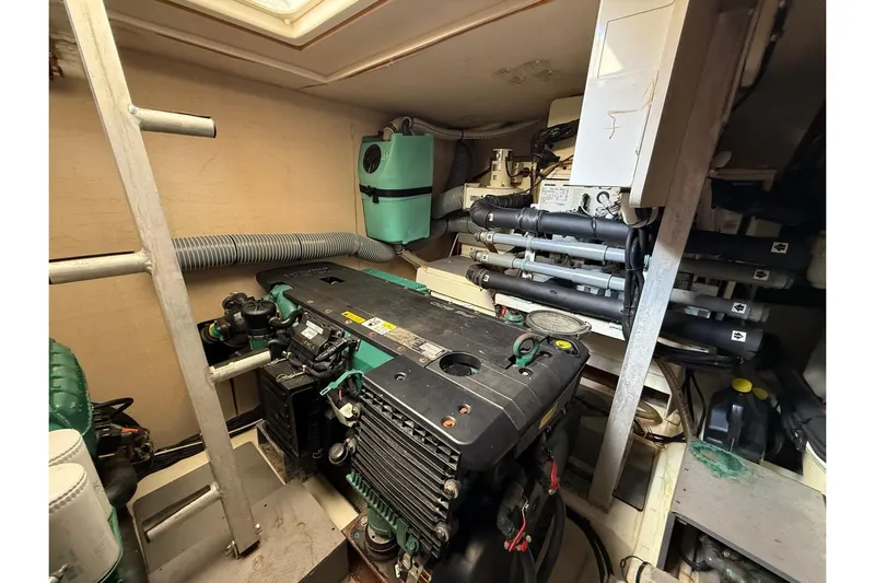 50 Prestige Flybridge Yacht Photos Pics Engine room of a 2013 Prestige 50 Flybridge yacht, showcasing mechanical components.