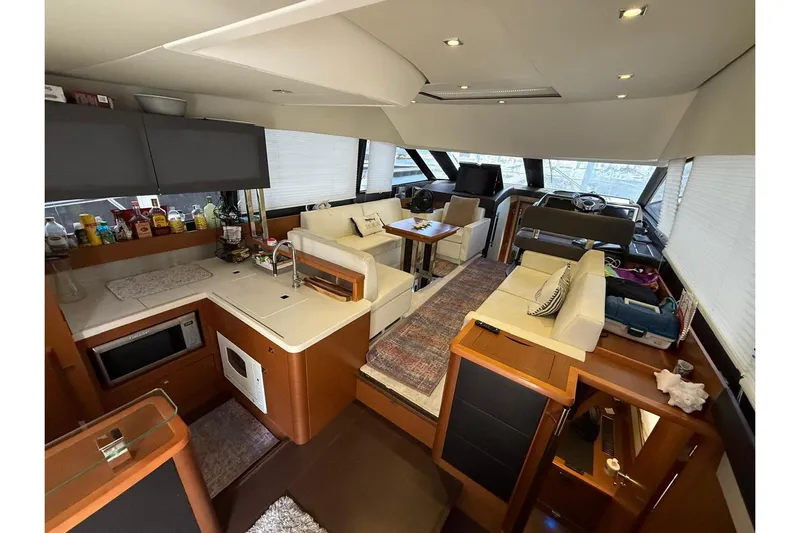 50 Prestige Flybridge Yacht Photos Pics Luxurious interior of 2013 Prestige 50 Flybridge yacht with modern kitchen and seating area.