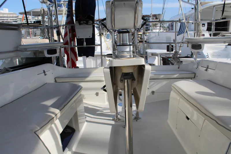 Cuckoo's Nest II Yacht Photos Pics Cockpit of a 2002 Catalina MkII sailboat with seating and steering wheel.